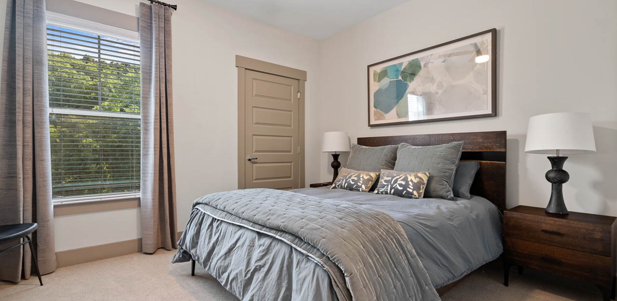 Hawthorne at Mills Gap spacious apartment bedroom with carpet and large windows
